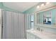 Bathroom featuring a shower with gray curtain, marble countertops, and vanity at 738 Riverview Cir, North Port, FL 34287