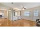 Bright living room features built-in cabinets, wood floors, and neutral paint at 738 Riverview Cir, North Port, FL 34287