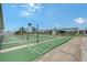A sunny view of the shuffleboard courts in a manufactured home community in sunny Florida with clear blue skies at 738 Riverview Cir, North Port, FL 34287