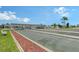 Outdoor shuffleboard courts with shade covering and benches in a waterfront community in sunny Florida at 738 Riverview Cir, North Port, FL 34287