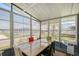 Bright sunroom with large windows offering lots of natural light and views of the neighborhood at 738 Riverview Cir, North Port, FL 34287