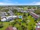 Aerial view of the community, highlighting the lush landscaping and community pool on a sunny day at 751 Capri Isles Blvd # 108, Venice, FL 34292