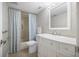 Bathroom with vanity, decorative mirror, toilet, and shower with patterned curtain at 751 Capri Isles Blvd # 108, Venice, FL 34292