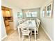 Bright dining room features a chandelier and seating for six at 751 Capri Isles Blvd # 108, Venice, FL 34292
