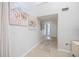 The Foyer has neutral paint, tile floor, art decoration and leads to the main living areas at 751 Capri Isles Blvd # 108, Venice, FL 34292