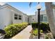 Inviting front entrance featuring a landscaped walkway and well-maintained exterior with tasteful planting at 751 Capri Isles Blvd # 108, Venice, FL 34292