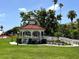 Charming gazebo in a green space with benches and a ramp at 751 Capri Isles Blvd # 108, Venice, FL 34292