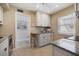 Bright kitchen features granite countertops, stainless steel appliances, and eat-in counter at 751 Capri Isles Blvd # 108, Venice, FL 34292