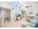 Spacious Living Room with high ceilings, ample natural light, and stylish decor that is perfect for relaxation at 751 Capri Isles Blvd # 108, Venice, FL 34292
