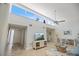 Bright Living Room featuring high ceilings, natural light, a TV, and views of the outdoor scenery at 751 Capri Isles Blvd # 108, Venice, FL 34292
