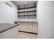 Mud room includes storage shelves, cabinets, and counter space at 751 Capri Isles Blvd # 108, Venice, FL 34292