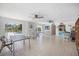 Large recreation room with tile floors and a view of the pool at 751 Capri Isles Blvd # 108, Venice, FL 34292