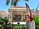 Venice Art Center with landscaped entrance, red metal statue, and attractive architecture at 751 Capri Isles Blvd # 108, Venice, FL 34292