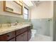 Bathroom featuring vintage green tile, white hexagon tile flooring, and marble countertops at 844 Senda Plata # 27, Venice, FL 34293