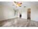 Bedroom featuring neutral walls, wood-look flooring, a closet, and a window at 844 Senda Plata # 27, Venice, FL 34293