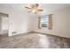 Bedroom featuring neutral walls, wood-look flooring, and a window at 844 Senda Plata # 27, Venice, FL 34293