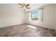 Simple bedroom featuring laminate wood flooring and a large window at 844 Senda Plata # 27, Venice, FL 34293