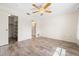 Simple bedroom featuring laminate wood flooring and two doorways at 844 Senda Plata # 27, Venice, FL 34293