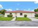 Inviting single-story home with a well-manicured lawn and an attached garage at 844 Senda Plata # 27, Venice, FL 34293