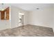 Airy living room with vinyl flooring and an open view to a bright kitchen, bathed in natural light at 844 Senda Plata # 27, Venice, FL 34293