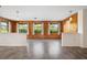 Spacious, wood-accented living room featuring hardwood floors, a ceiling fan, and recessed lighting at 844 Senda Plata # 27, Venice, FL 34293