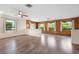 Spacious, wood-accented living room featuring hardwood floors, a ceiling fan, and recessed lighting at 844 Senda Plata # 27, Venice, FL 34293