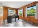 Charming wood-paneled home office bathed in natural light, showcasing tranquil views and modern finishes at 844 Senda Plata # 27, Venice, FL 34293