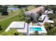 Aerial view shows the condo is ideally located near a golf course, community pool, parking and lush landscape at 849 Wexford Blvd # 849, Venice, FL 34293