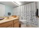 This well-lit bathroom features a single vanity and a shower-tub combination at 849 Wexford Blvd # 849, Venice, FL 34293