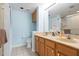 Bathroom featuring double sinks, wood cabinetry, and a tiled floor at 849 Wexford Blvd # 849, Venice, FL 34293