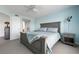 This bedroom features a ceiling fan, cozy bed, and an ensuite bathroom for added convenience at 849 Wexford Blvd # 849, Venice, FL 34293