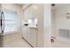 Bright hallway with built-in cabinets and adjacent bedroom with window at 849 Wexford Blvd # 849, Venice, FL 34293
