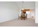 Open-concept living space featuring vaulted ceilings and dining area at 849 Wexford Blvd # 849, Venice, FL 34293