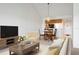 Bright living room with dining area, vaulted ceiling, and hardwood-style flooring at 849 Wexford Blvd # 849, Venice, FL 34293