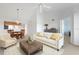 Inviting living room with vaulted ceilings, a comfortable couch, and adjacent dining area at 849 Wexford Blvd # 849, Venice, FL 34293