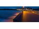 Nighttime view of pier lit by streetlights, offering a scenic ocean experience at 849 Wexford Blvd # 849, Venice, FL 34293