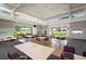 Spacious rec room contains many tables, chairs, tile and carpet flooring, large windows with great green views at 849 Wexford Blvd # 849, Venice, FL 34293