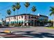 Charming pink corner building with awnings offers a glimpse into the unique architecture of the neighborhood at 849 Wexford Blvd # 849, Venice, FL 34293
