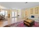 Open living area with tile floors, bright lighting, and views to the dining room at 925 S Doral Ln, Venice, FL 34293