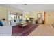 Cozy living room with neutral walls, stylish decor, and tile flooring at 925 S Doral Ln, Venice, FL 34293