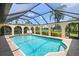 Beautiful pool with screened-in enclosure offers a perfect outdoor retreat at 925 S Doral Ln, Venice, FL 34293