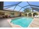 Relaxing screened-in pool with plenty of space for outdoor dining and lounging at 925 S Doral Ln, Venice, FL 34293