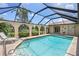 Beautiful screened-in pool with arches and lush greenery, perfect for entertaining at 925 S Doral Ln, Venice, FL 34293