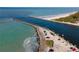Aerial view of a jetty with parked cars, separating the ocean from the bay at 9917 Haze Dr, Venice, FL 34292