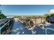 A wooden boardwalk offers beach access, framed by lush vegetation and clear blue sky, for a serene view at 9917 Haze Dr, Venice, FL 34292