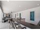 Outdoor bar area with seating and a sleek design, perfect for entertaining in style at 9917 Haze Dr, Venice, FL 34292