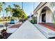 Picturesque sidewalk featuring beautiful tropical landscaping and charming architectural details at 9917 Haze Dr, Venice, FL 34292
