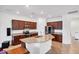Bright kitchen featuring stainless steel appliances, granite countertops, and an island at 10061 Cozy Grove Dr, Venice, FL 34293