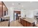 Modern kitchen with stainless steel appliances, granite countertops, and ample cabinet space at 10061 Cozy Grove Dr, Venice, FL 34293