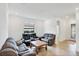 Comfortable living room with neutral tones, tile flooring, and ample seating at 10061 Cozy Grove Dr, Venice, FL 34293
